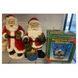 Santa Figurines and Musical Blinking Light Display