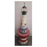 Painted Lighthouse-Themed Sculpture, on pedestal 1