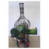 Metal Bottle Holder With Four Green Bottles