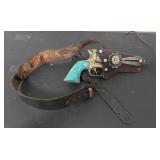 Toy Cap Gun with Turquoise Handle and Leather Hols