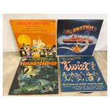 Four Vintage Vinyl Records With Various Themes