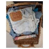 Basket of Denim Apparel and Harry Potter Book