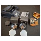 Camera With Lenses, Accessories, and Carry Case