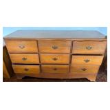 Wooden Nine-Drawer Dresser With Brass Pulls