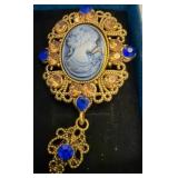 Gold-Tone Cameo Brooch With Blue and Amber Stones