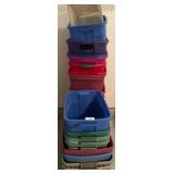 Stack of Plastic Storage Bins in Various Colors