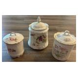 Three Ceramic Canisters with Floral Motifs