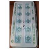 Reused Egg Carton Holding Assorted Golf Balls