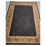 Area Rug with Geometric Border Design