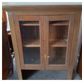 Wood Cabinet With Glass Doors and Brass Latch