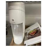 White SodaStream Machine with Recipe Booklet