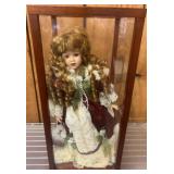 Porcelain Doll in Display Case