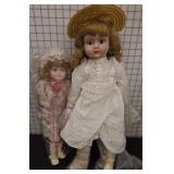 Two Porcelain Dolls in Period Dresses