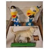 Mascot Bobbleheads and Barefoot Landing Dog
