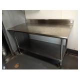 60" X 30" SS TABLE WITH BACK GUARD ON WHEELS