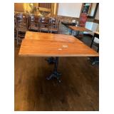 54" X 38" WOOD TOP TABLES WITH CAST IRON BASES