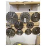 LOT SAW BLADES ON WALL