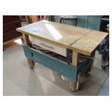 Work table on wheels with drawers and vice