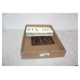 SEVEN VINTAGE LICENSE PLATES