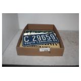 ELEVEN VINTAGE LICENSE PLATES