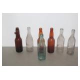 7 ADVERTISING BOTTLES