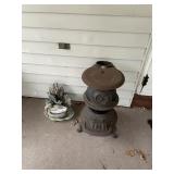 CAST IRON STOVE ON BACK PATIO AND DUCK - GARDEN
