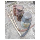 Three Metal Milk Cans and Two Scythe Blades