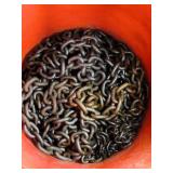 Metal chain in red plastic bucket