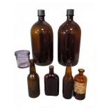 Seven Glass Bottles and One Jar