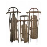 Three Wooden Snow Sleds with Metal Runners
