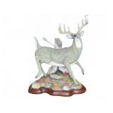 Jumping the Bow Deer Figurine by Greg Chomichuk