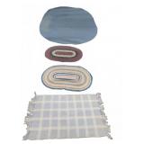 Four Oval And Rectangular Rugs