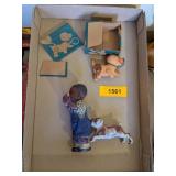 BLACK AMERICANA WIND-UP DOG BITING BOY