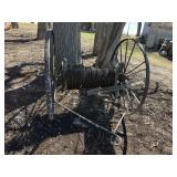 VINTAGE SPOOL OF BARBED WIRE ON TRAILER