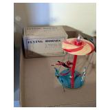 FLYING HORSES TIN TOY WITH ORIGINAL BOX