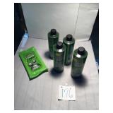 Four bottles of laundry detergent and one package