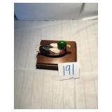 A wooden deck box with playing cards
