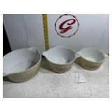 Three Pyrex bowls