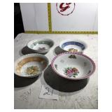 Four bowls with flower and fruit designs