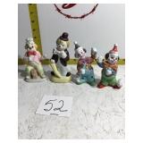 Four clown figurines