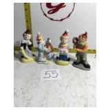 4 clown figurines
