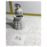 Porcelain woman figure with basket