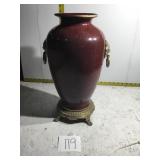 Vase with lion head handles