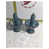 Two carnival glass candleholders with candles