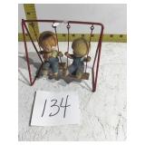 2 characters on a swing