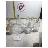 Miscellaneous glass bottles and dish