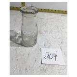 Small milk glass bottle it says dairy milk by