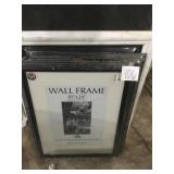 Four un opened wall frames 18 x 24 and one white