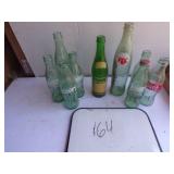 7 coke bottles 1 rc & 1 upper 10 bottle