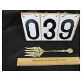 Very ornate gold tone serving fork